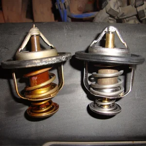 Замена термостата Mazda Demio