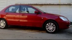 Снятие, установка переднего крыла Mitsubishi Lancer IX