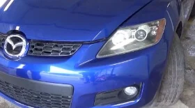 Замена лампы дальнего света Мазда СХ-7