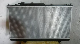 Замена радиатора двигателя и термостата на Митсубиси Лансер 9